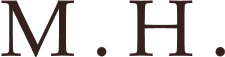 M.H.